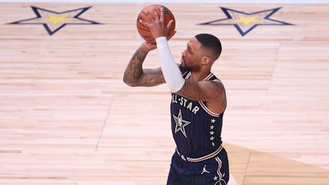 Eastern Conference guard Damian Lillard (0) of the Milwaukee Bucks attempts a three point basket against the Western Conference All-Stars during the third quarter in the 73rd NBA All Star game at Gainbridge Fieldhouse.